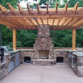 Housewarmings Outdoor custom-design outdoor room with a kitchen island, a fireplace and a pergola