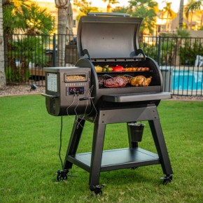 Black Label Series Pellet Grill from Louisiana Grill with Wi-Fi control in a garden – We Love Fire