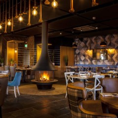 Wood Fireplace JC Bordelet Zelia by Ambiance® in a restaurant- We Love Fire®