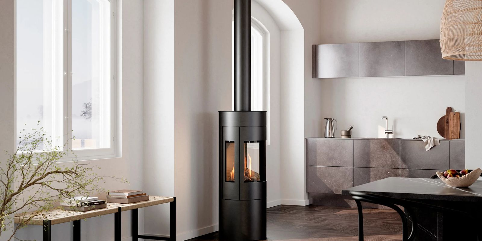 RAIS® freestanding stove with a lit fire in a bright, modern living room
