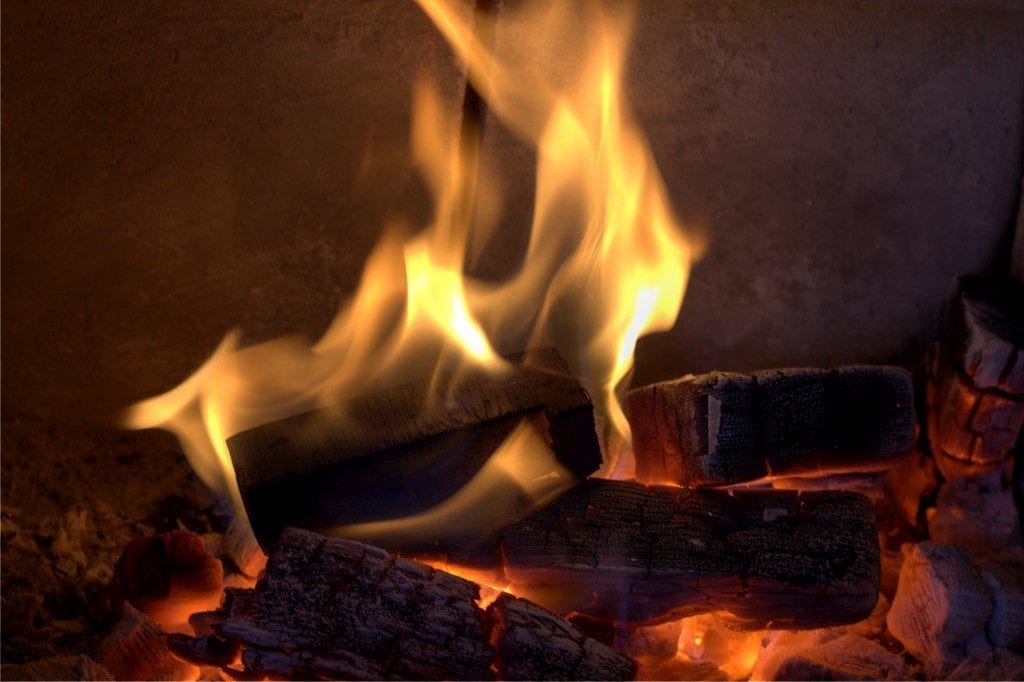 This fire burns in an old gas fireplace converted in a wood fireplace.