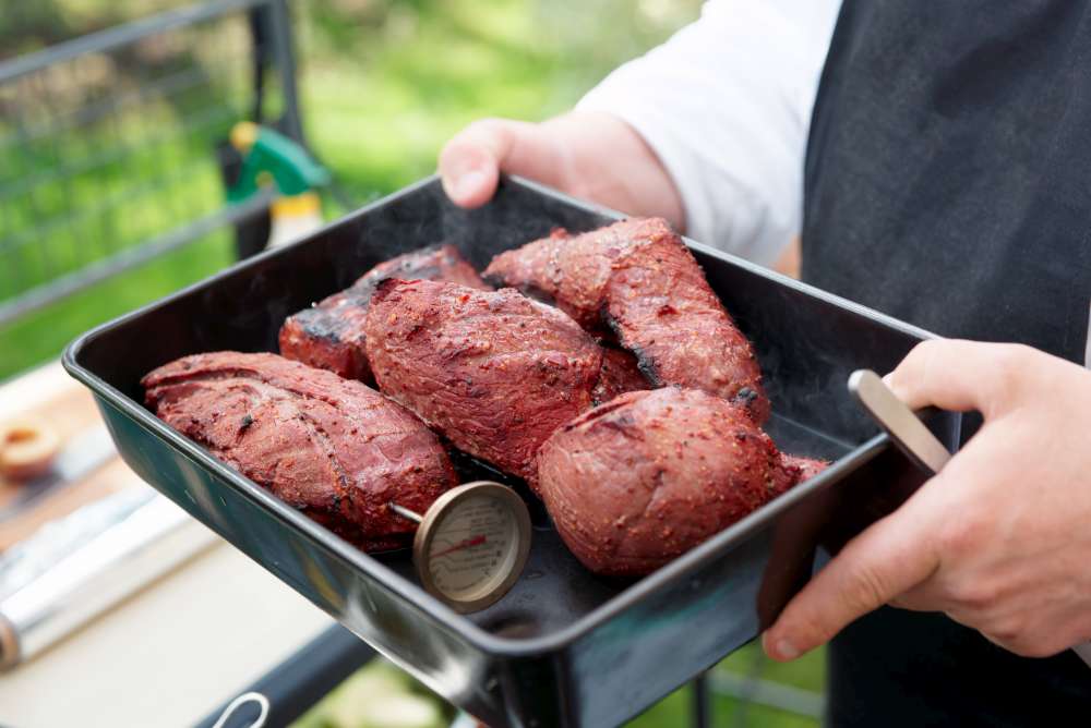Avoiding using a dish that has been used for raw meat after cooking and well grilling meat are two important precautions you should take to reduce risk of food poisoning.