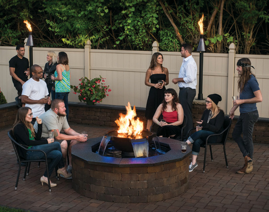 Family and Friends Gathered Around a Gas Firepit