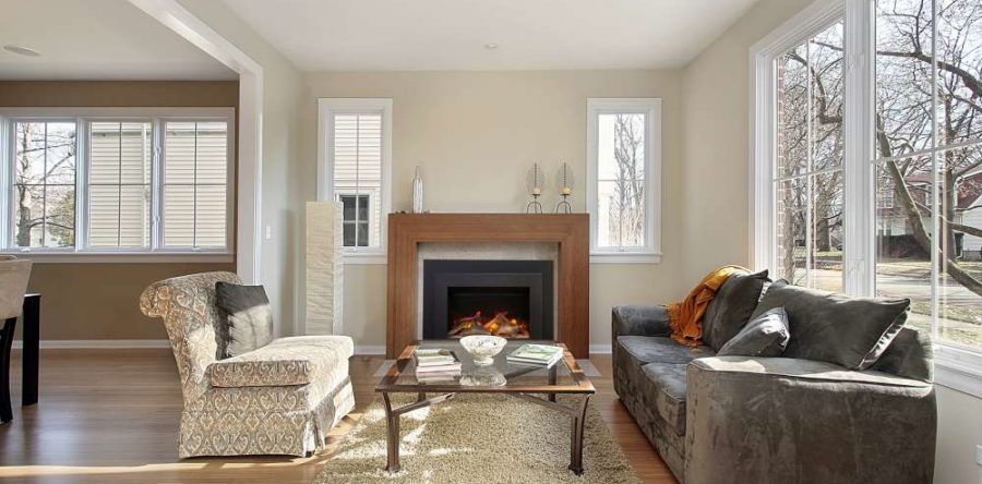 Can I use an electric fireplace as an insert for my old wood-burning fireplace?