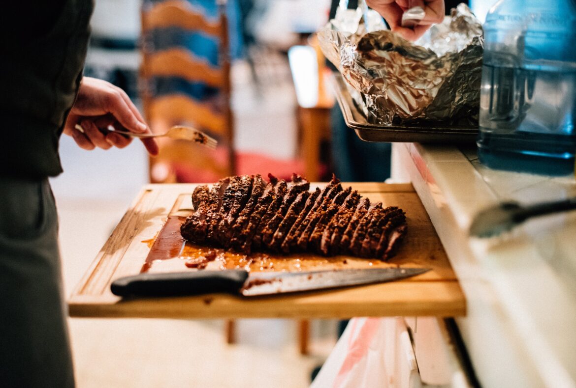 Juicy tender low n slow cooked meat on cutting board