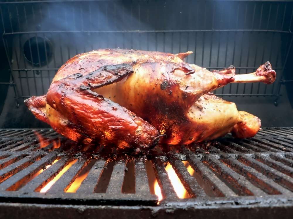 Tasty turkey cooked low and slow. How to smoke or grill a turkey?