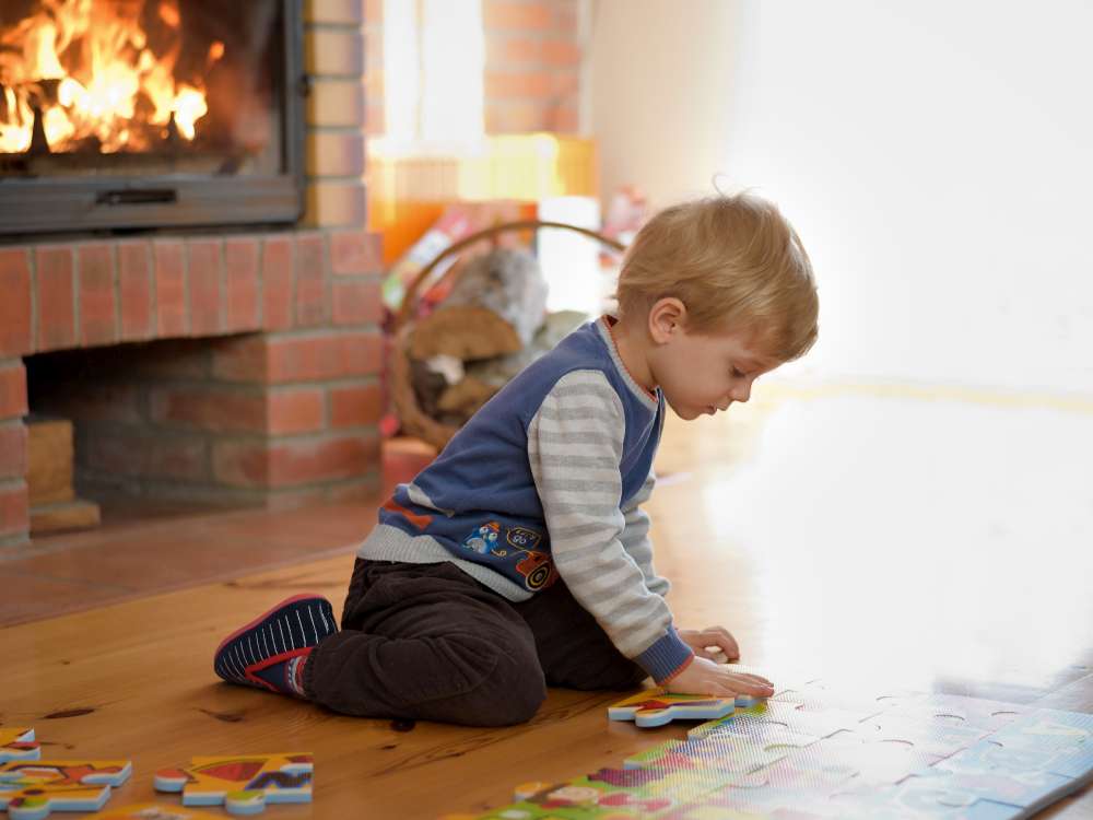 Kid playing in the livingroom while fireplace is on. Are fireplaces safe for a family?