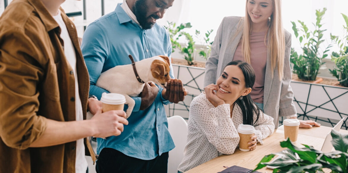 Create a Haven with a Hygge Office Space - a man brings his dog at work