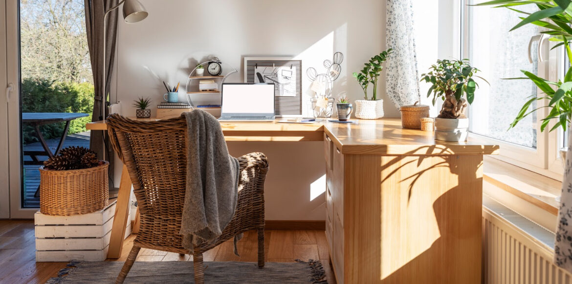 Create a Haven with a Hygge Office Space - home work place with plants, blanket