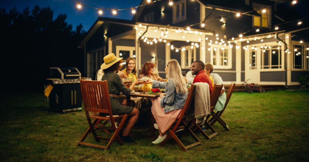A group of friends are doing a bbq in a garden